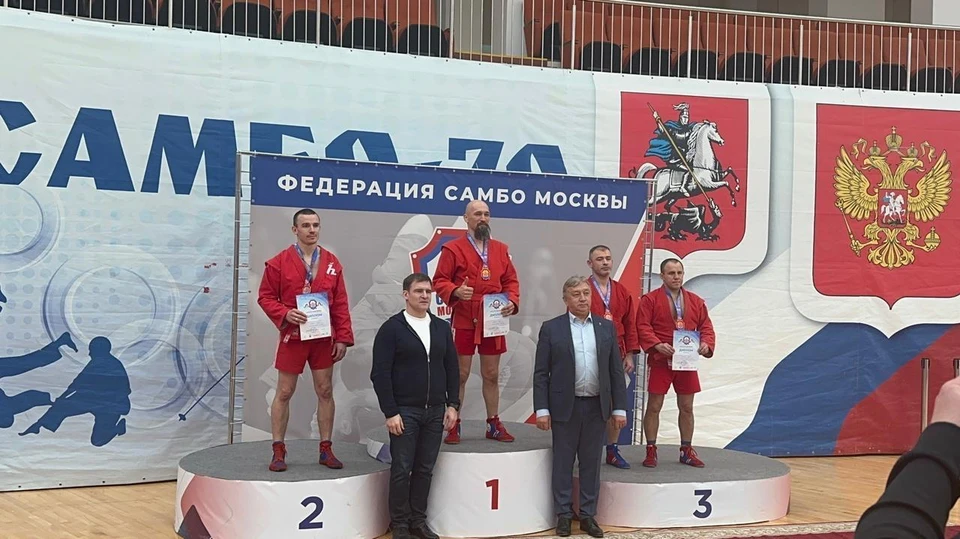 Александр Лукин (крайний справа) на пьедестале.